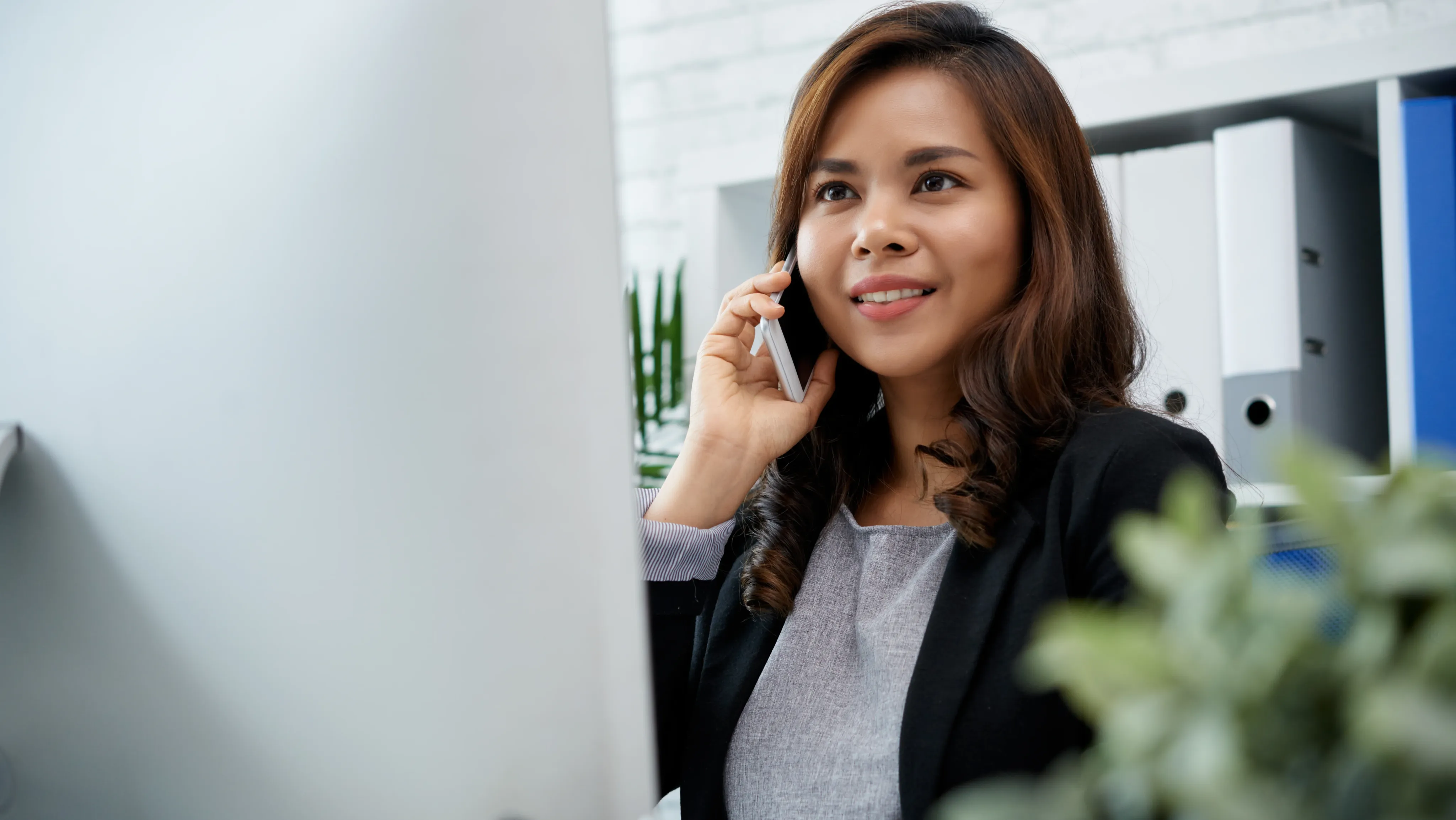 Asian woman talking on phone